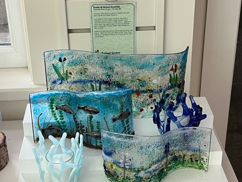 A collection of blue coastal fused-glass artwork